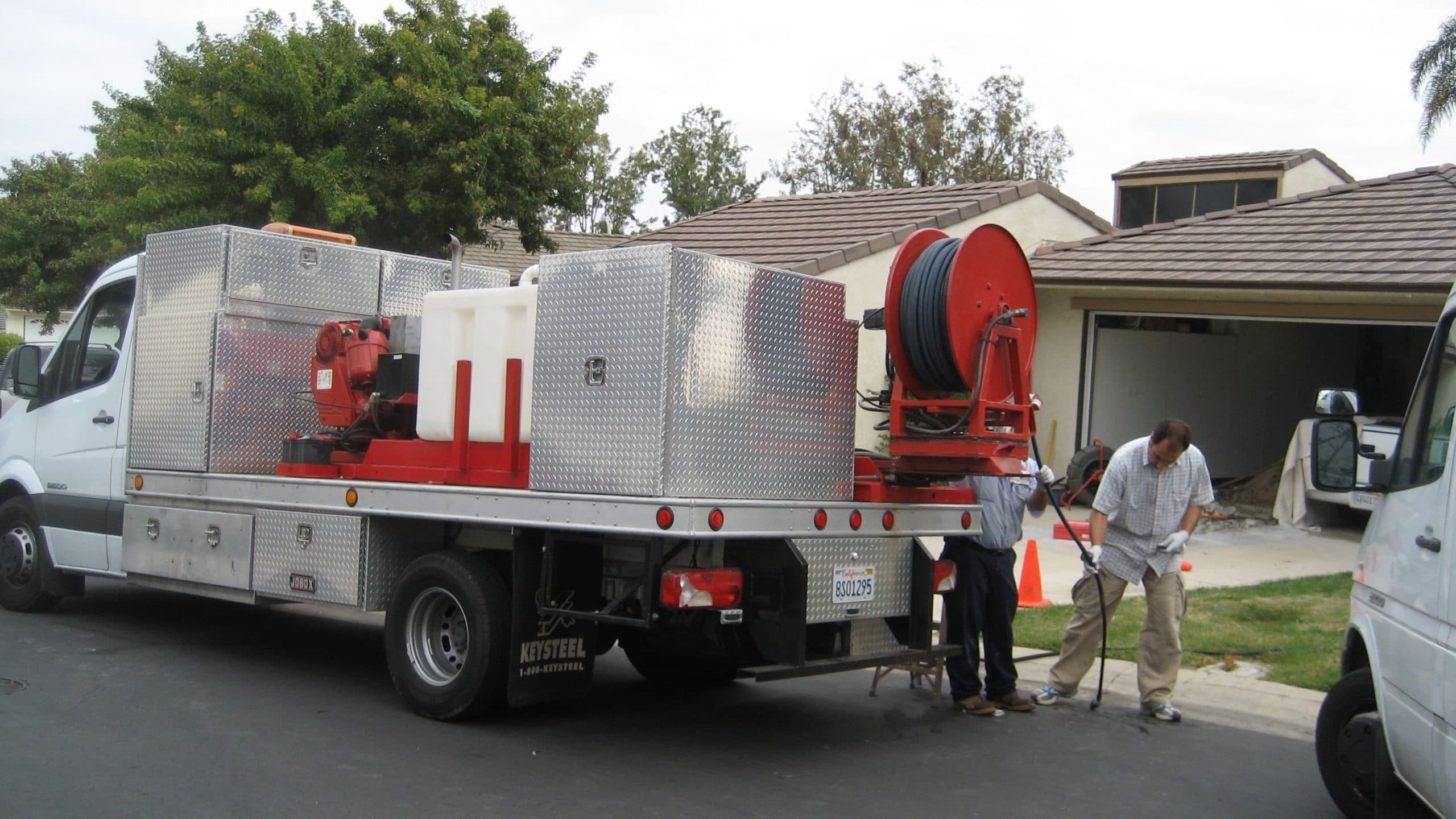 Hydro-jet drain cleaning rig on a job